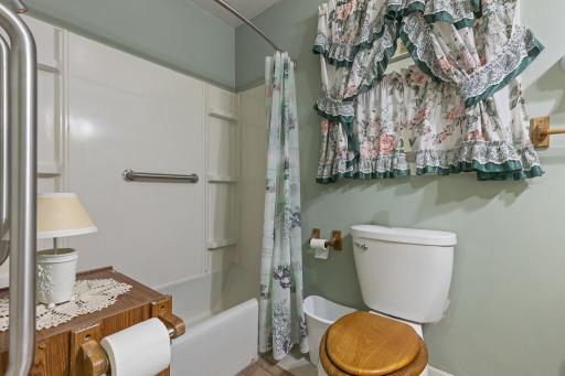 The full bathroom features grab bars if needed for added accessibility