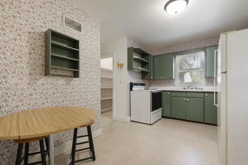 Step in to the cutest kitchen! Simplicity at its finest with room for casual seating for easy meals