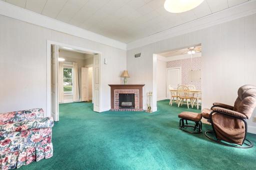 Such a charming living room and central fireplace ready to update!