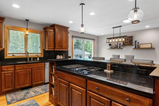 Center island cooktop with granite counters