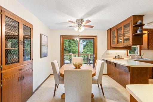 Dining room with built in china cabinet and door to deck