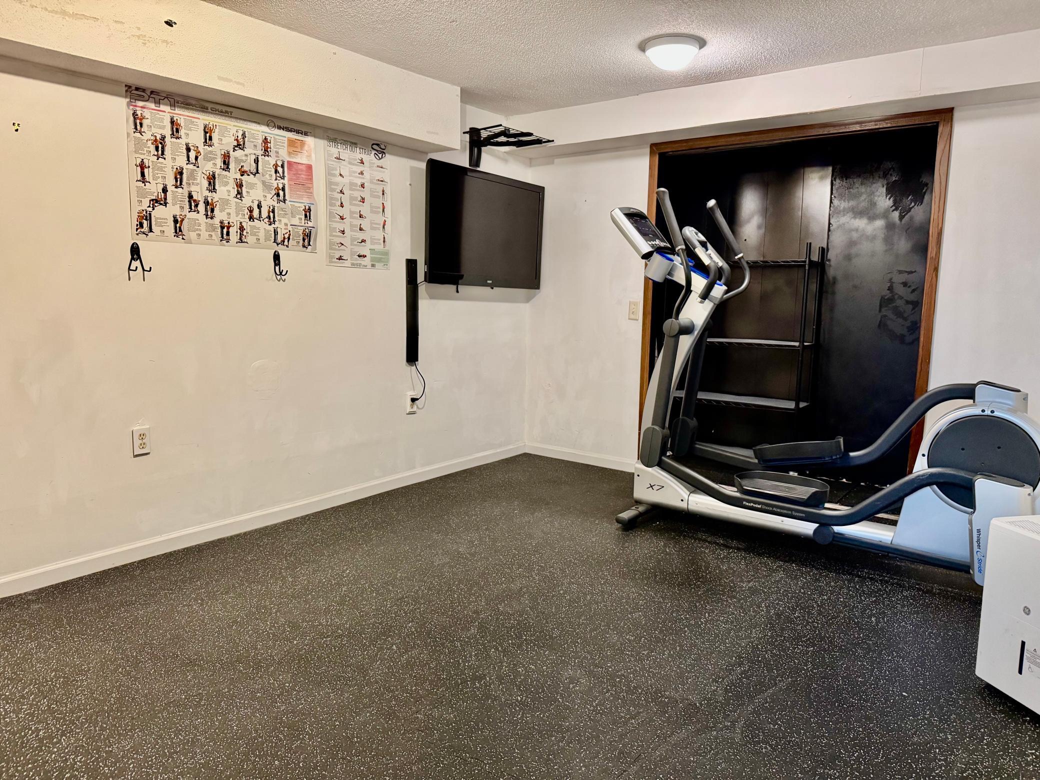 Lower level features a spacious flex room (Gym, Den, Family Room) with newer vinyl plank flooring.