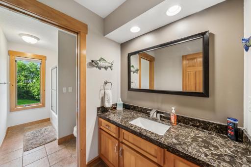 The main floor full bath is both spacious and well-equipped.