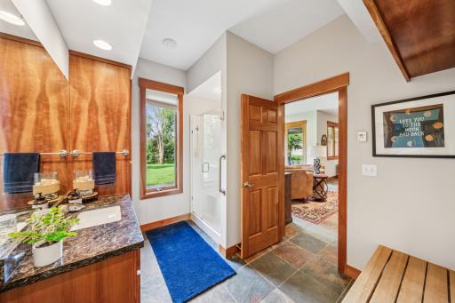 The lower level three-quarter bath is easily accessed by family and guests.
