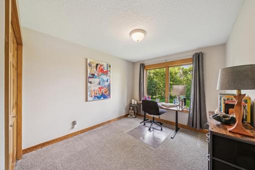 A second of four main floor bedrooms is currently designated as an at home office.