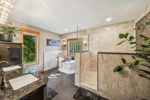 The newly renovated primary ensuite bath provides a spa experience perfect for escaping all the cares of the world!