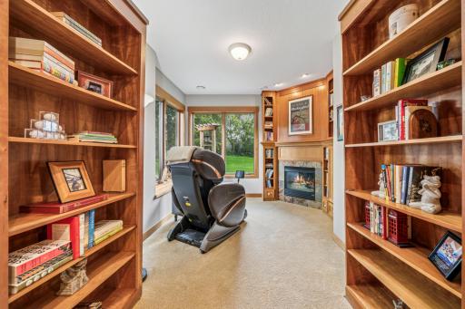 Your own 'secret library' is hidden behind a set of bookcase-faced doors off the lower family room!