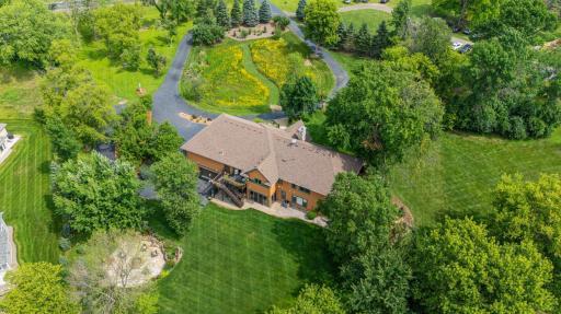 Aerial view facing north toward back of home.