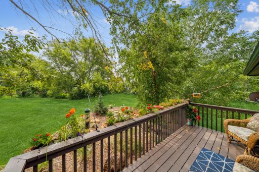 This picturesque view of the backyard from your primary bedroom balcony is the perfect respite at the end of a trying day. The melody from the backyard water fall will take your stress away.