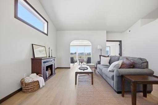 Living room, with transom windows, adjacent to the sun room - lots of space and light.