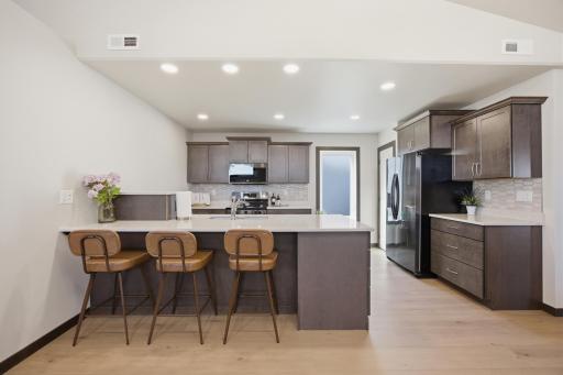 Great kitchen! With lots of light, a corner pantry and a window
