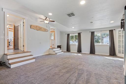 New carpet, new subfloor, new sheetrock, new paint, new barndoors! So much to love!