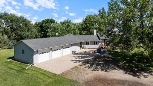 Yes, that is an OVERSIZED THREE STALL GARAGE attached to the home!
