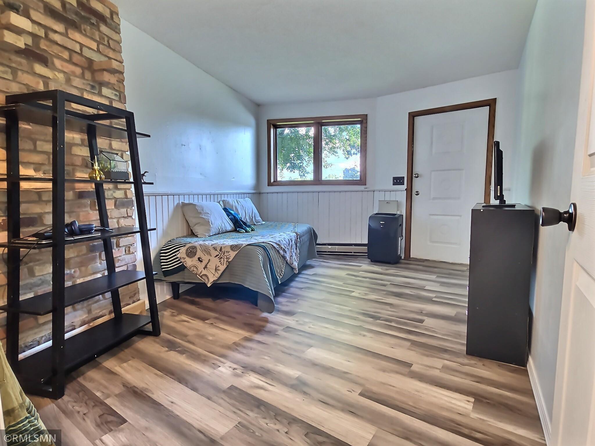 3rd bedroom with access door to lower level patio
