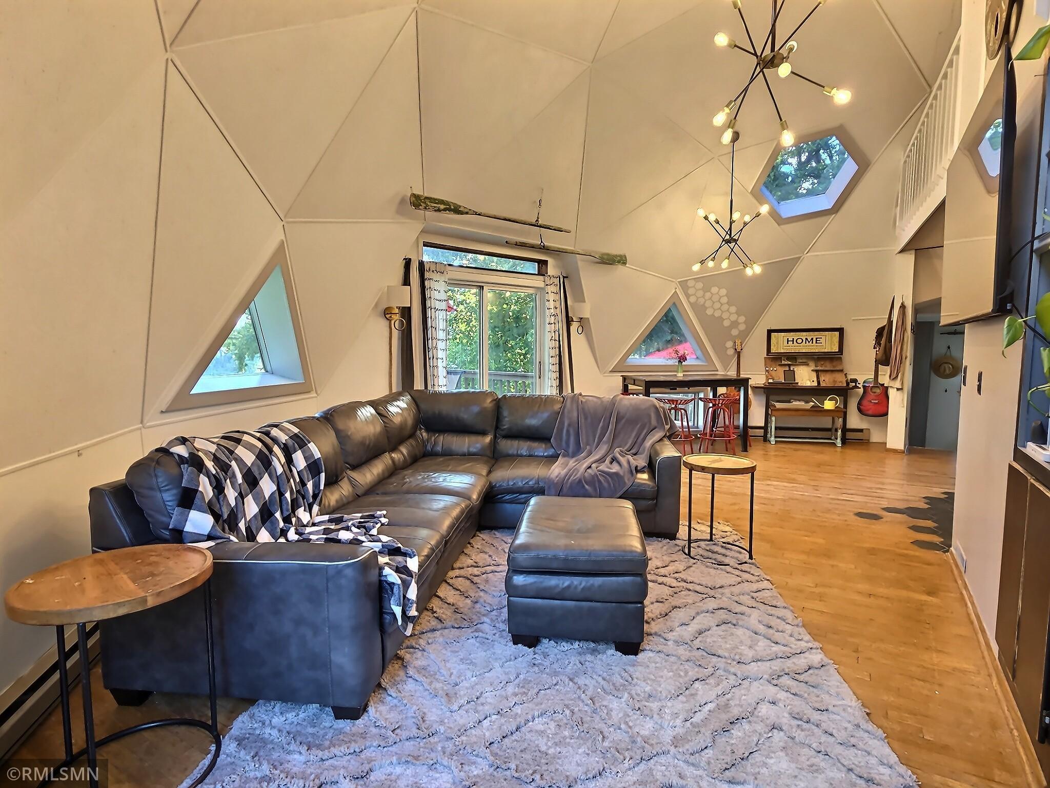 Living room with patio door taking you to one of the decks