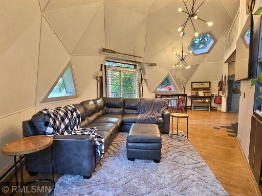 Living room with patio door taking you to one of the decks