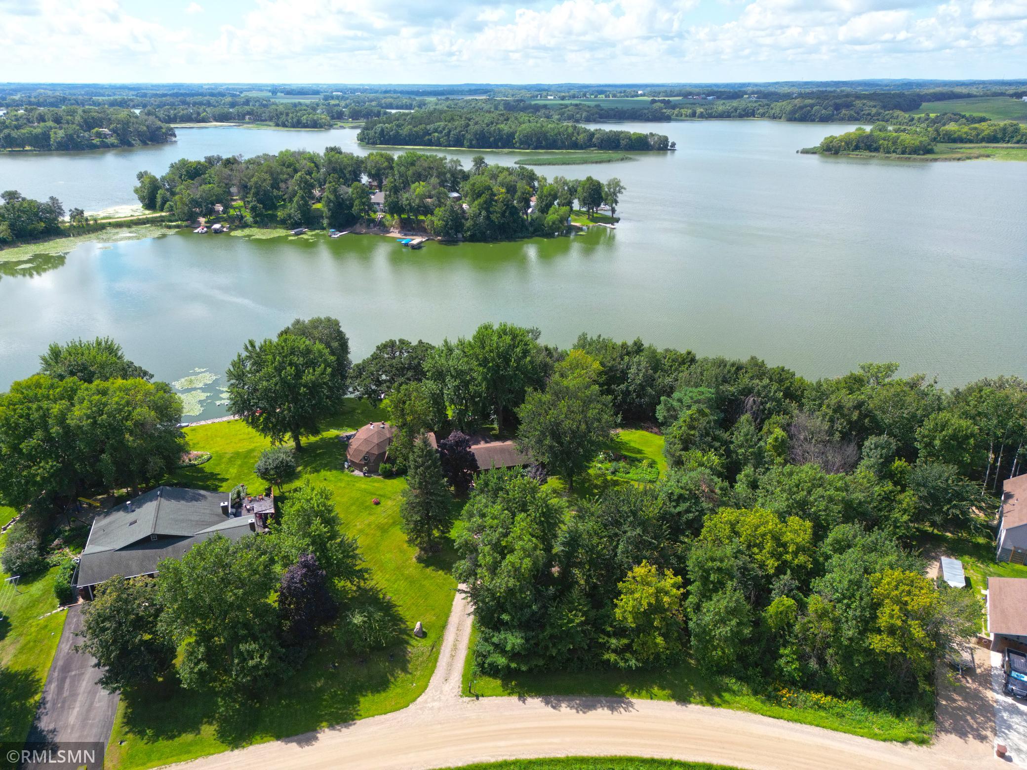 Two parcels combined for 1.57 acres, wooded area to the right is part of the 2nd parcel