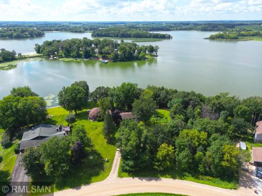 Two parcels combined for 1.57 acres, wooded area to the right is part of the 2nd parcel