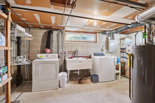 Lower Level Mechanical Room w/Washer & Dryer. All Appliances Stay. GREAT Storage Area!