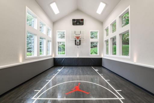 Welcome to 7216 Gunflint Trail - from pillar to post, every surface of this home has been remodeled with the highest quality fit and finishes including the addition of a showstopping sport court!