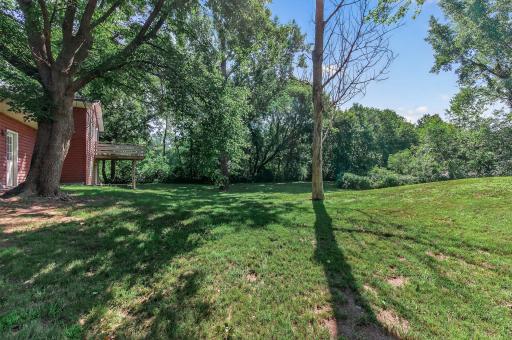 This lot provides the perfect balance of wooded privacy and open space!