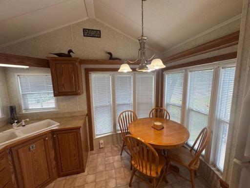 Dining room is surrounded by many windows