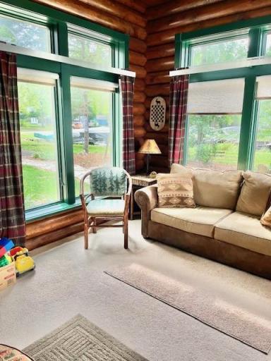 4 season sun room just off the great room. From this side great views of the harbor immediately next door