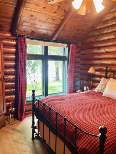 Main floor primary bedroom is private and off on its own. Wonderful lake views as you are waking up