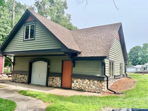 Huge detached garage with loft storage above, and double door on the other side.