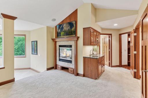 Fireplace in owners suite with beverage station, wake up with coffee