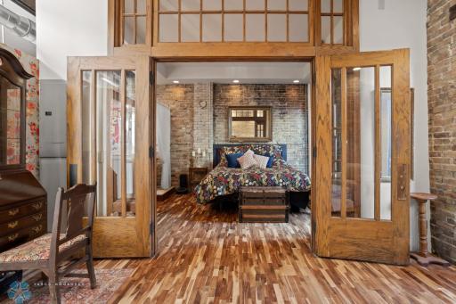 Antique french doors from an old school in West Fargo - looking toward primary bedroom