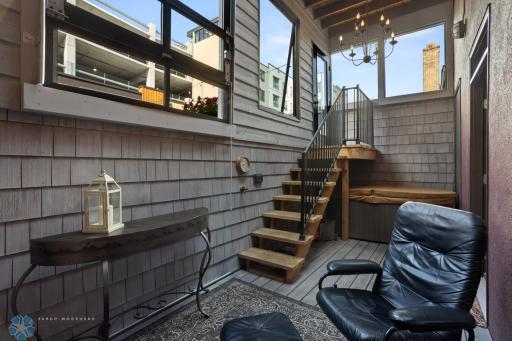 Back porch outside primary bedroom area (hot tub)