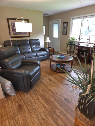 Enter into Living room with beautiful Hardwood floors
