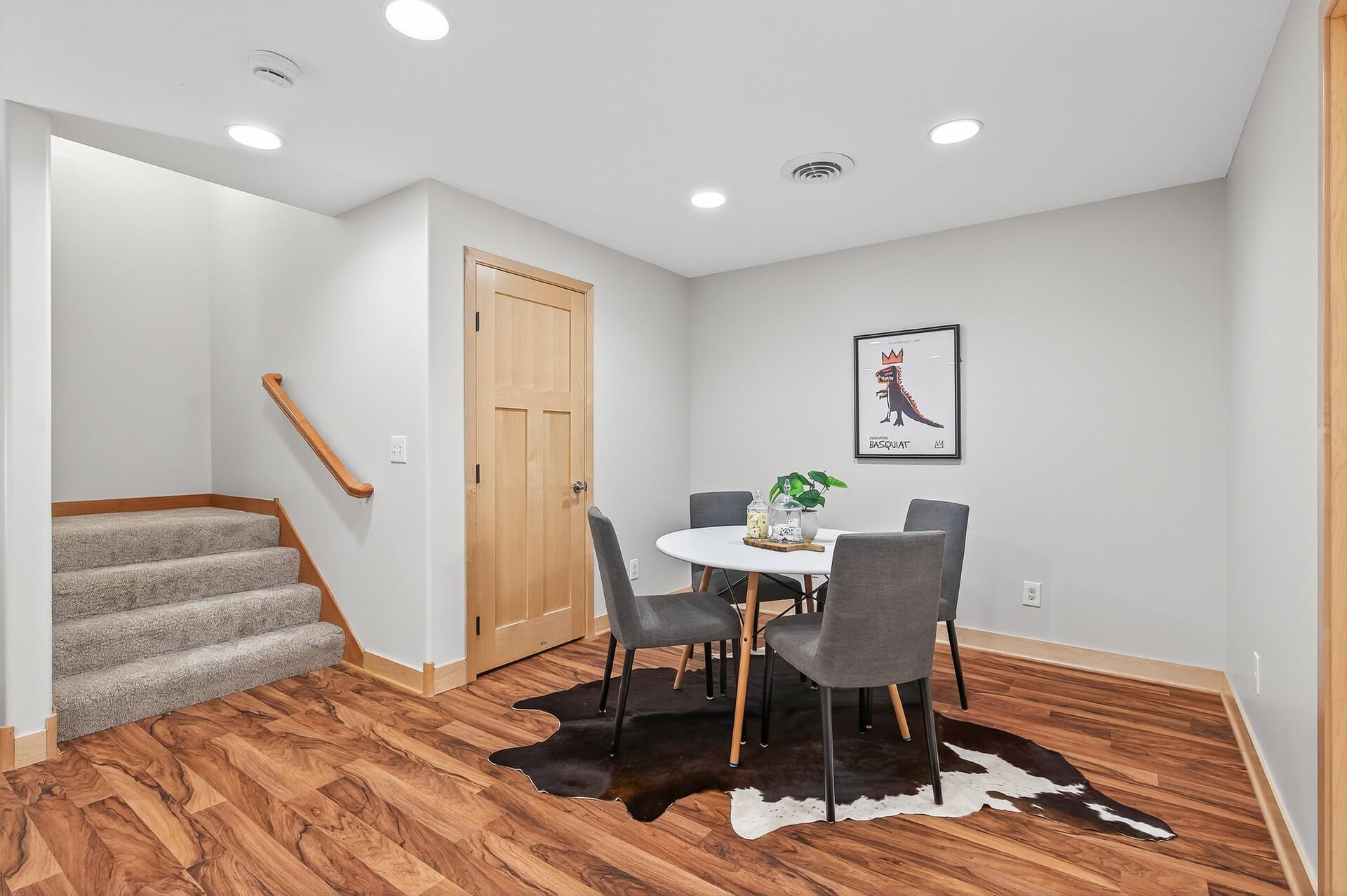 Finished basement with wood flooring