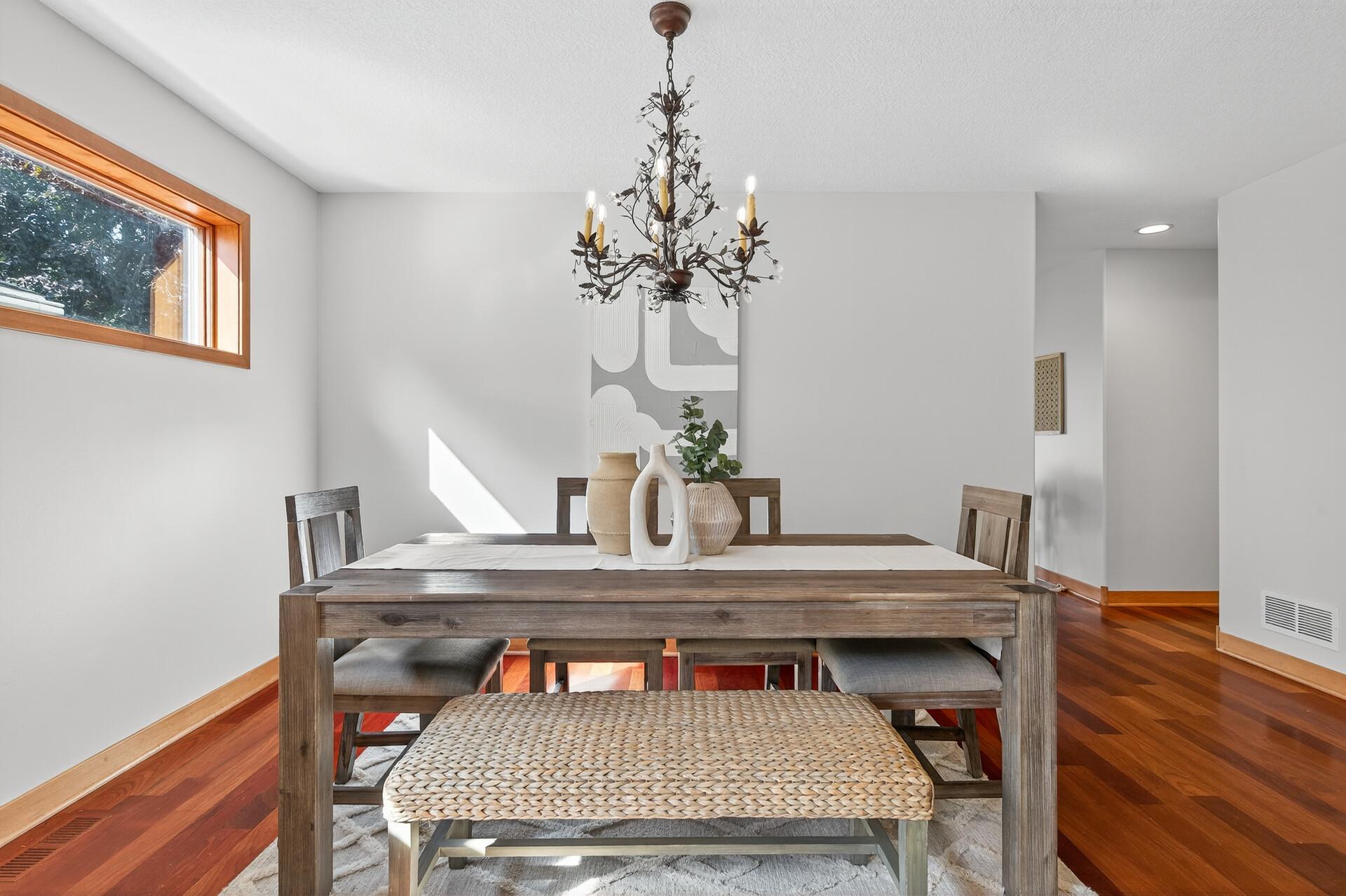 Elegant chandelier adds a touch of charm to the dining area