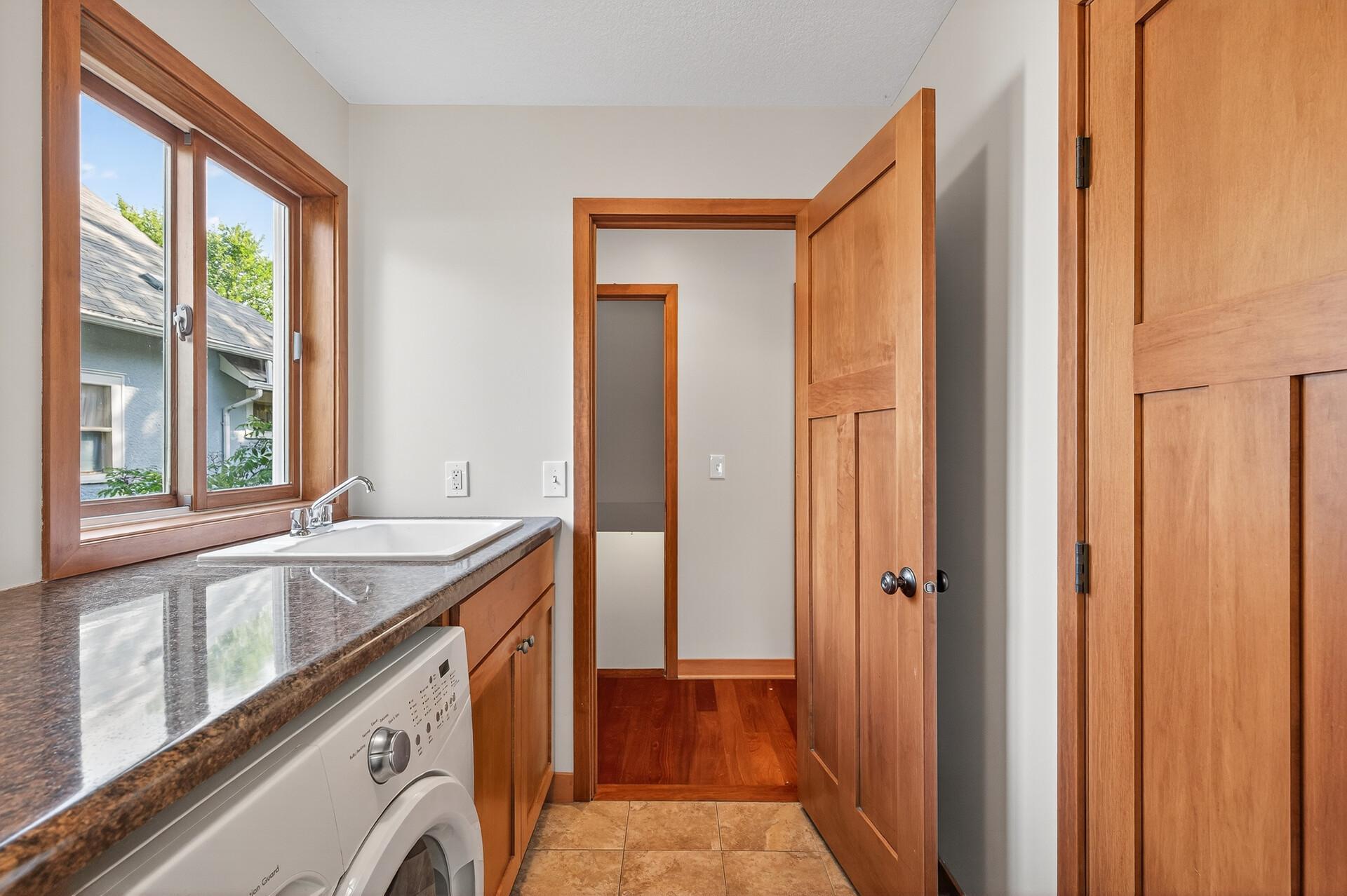 Laundry room with sink and closet storage!
