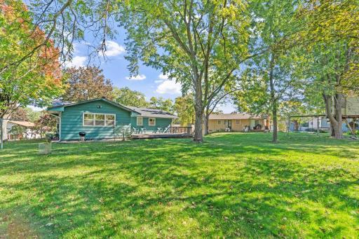 Beautiful, level backyard with plenty of space for gardening or outdoor activities.