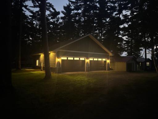 Professional photos coming soon. 8 car garage 4x4 tandem on this .82 acre lot. Single garage, bunk house and main cabin in view.