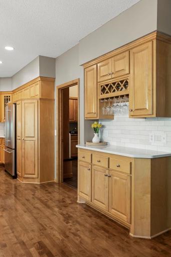 A buffet counter with extra cabinetry adds convenient storage and serving space.