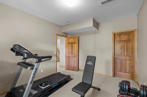 A fifth bedroom with a walk in closet is perfect for a home office or for guests.