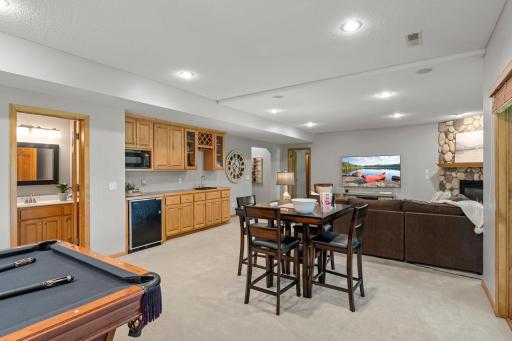 A recreation room (pool table negotiable), built-in surround sound, and a wet bar with beverage fridge and microwave make it perfect for entertaining.