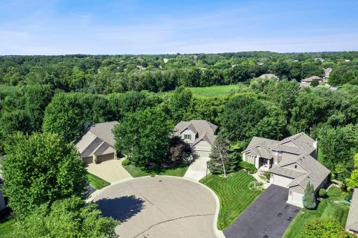 Designed for comfort and versatility, the layout blends main-level living with generous guest accommodations and timeless detail.