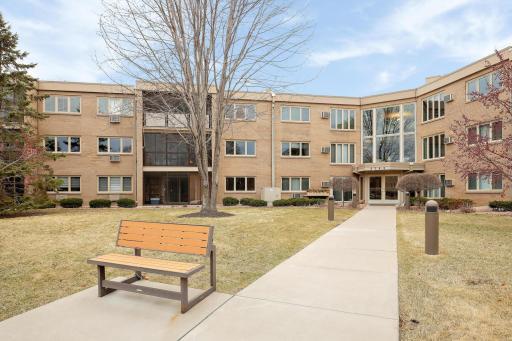 Beautiful all brick Edina condominium which backs up to Meadowbrook Lake & Minnehaha Creek.