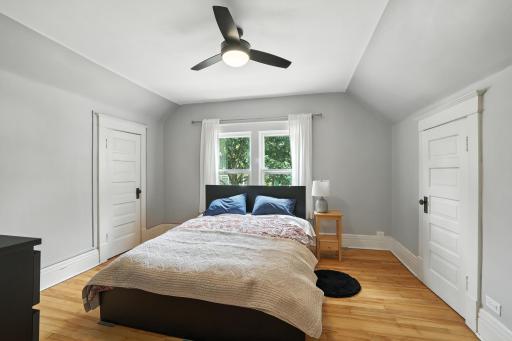 Primary bedroom has closet on each side of room
