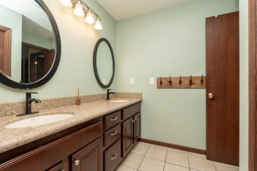 Upper level full bathroom with dual sinks