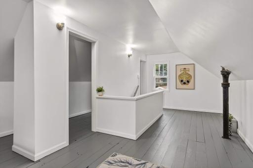 Spacious second-level bedroom with room for a desk and a walk-in closet..