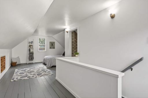 Spacious and bright second-level bedroom.