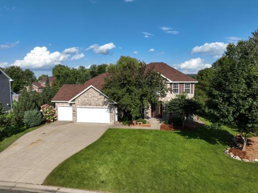 Stunning Corner Lot Two Story with incredible Curb Appeal, Beautiful Landscaping and Spacious Interior.