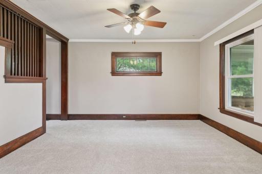 Another view of the living room. Stairs on the left lead to the upper level.