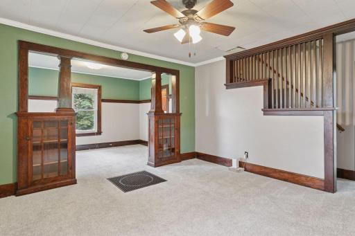 This photo highlights the built-ins that divide the living and dining areas.